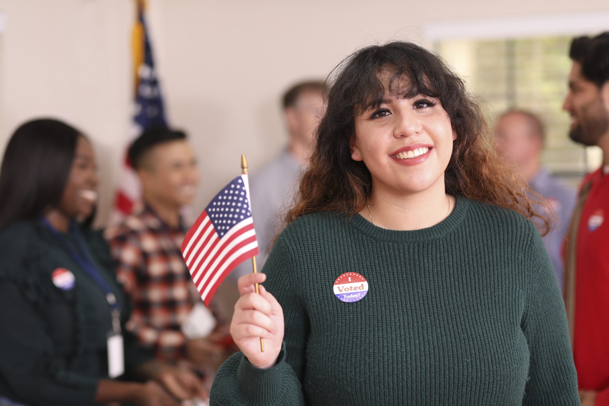 Voter celebrating with flag